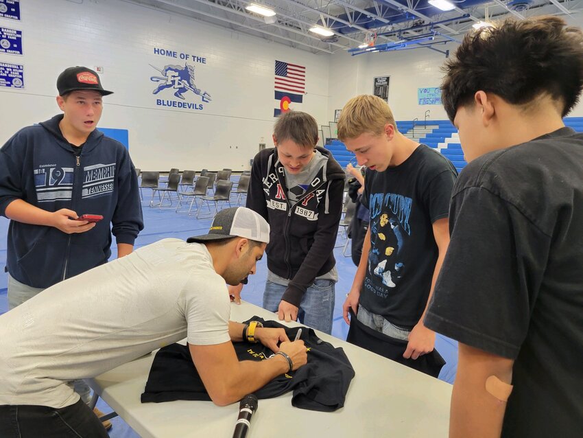 After the event, students gave feedback to Jordan Toma, and he signed their T-shirts.